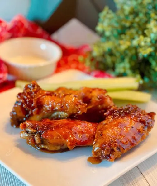 Copy Cat Winger Wings on a plate with celery