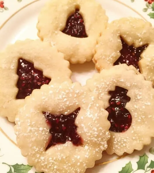 Linzer Cookies on Christmas plate ready for eating
