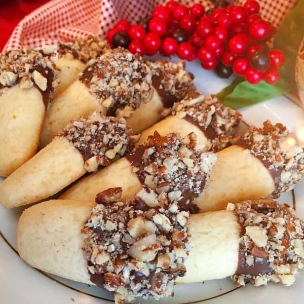 orange shortbread cookie dipped in dark and nuts