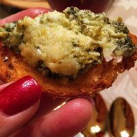 Spinach artichoke dip on a cracker