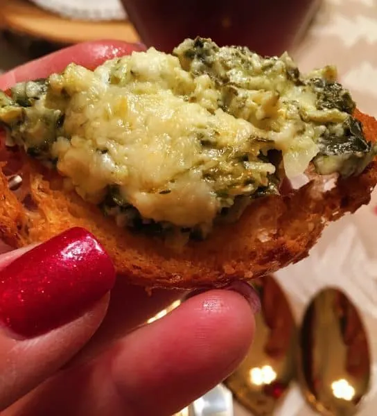 Garlic Crostinni topped with Hot Spinach Artichoke dip