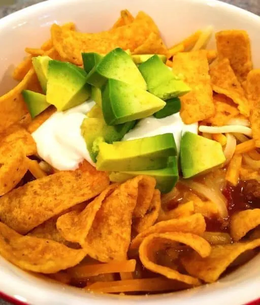 taco soup with fritos, avocado, and sour cream