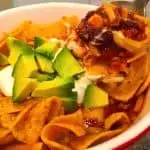 Taco Soup in a bowl with a spoonful lifted out.
