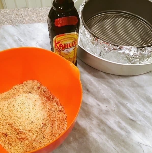 cookie crumbs with Kahlua and butter ready to put in the springform pan