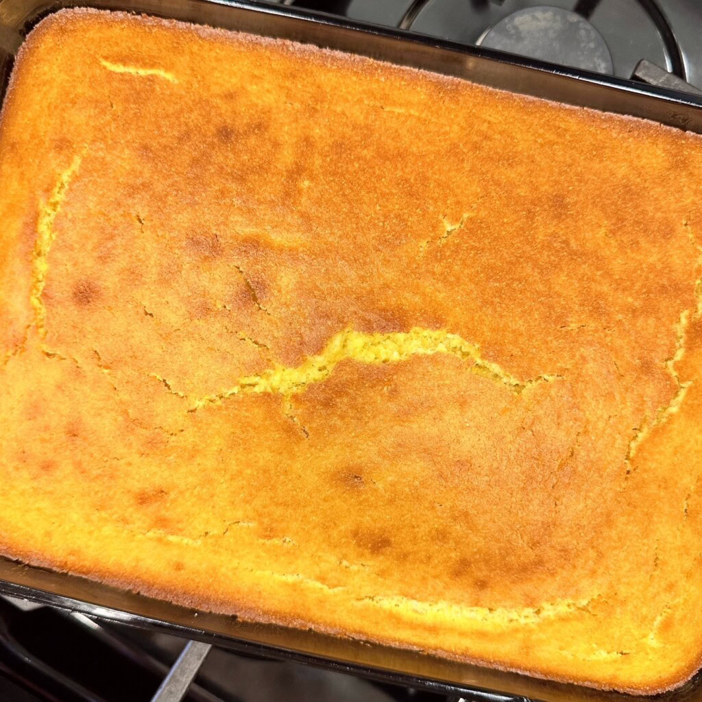 Baked cornbread cooling on stove top.