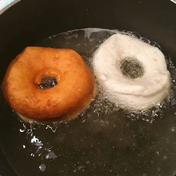 Grand Biscuit Donuts frying in hot oil