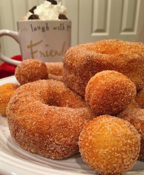 Plate full of fluffy puffy Grands Biscuits Fried Cinnamon Sugar Donuts