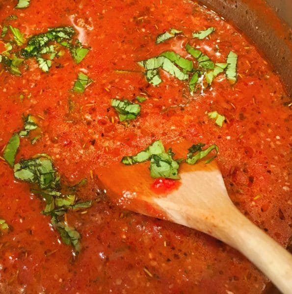 Adding fresh basil to soup