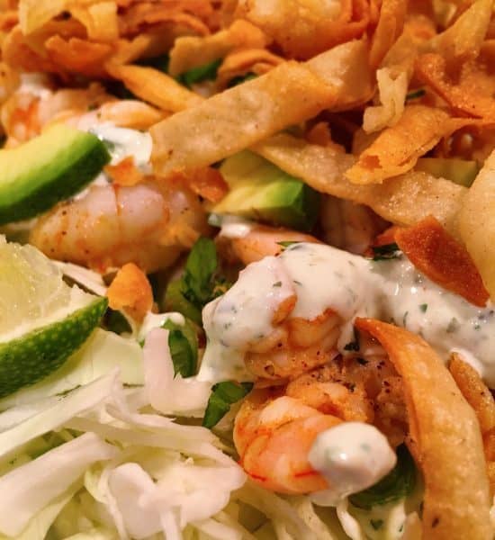 Shrimp Taco Salad with fresh lime cilantro creme dressing 