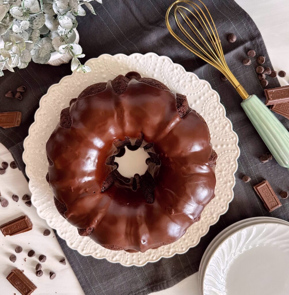One more overhead shot of whole too much chocolate bundt cake with chocolate pieces surrounding it.