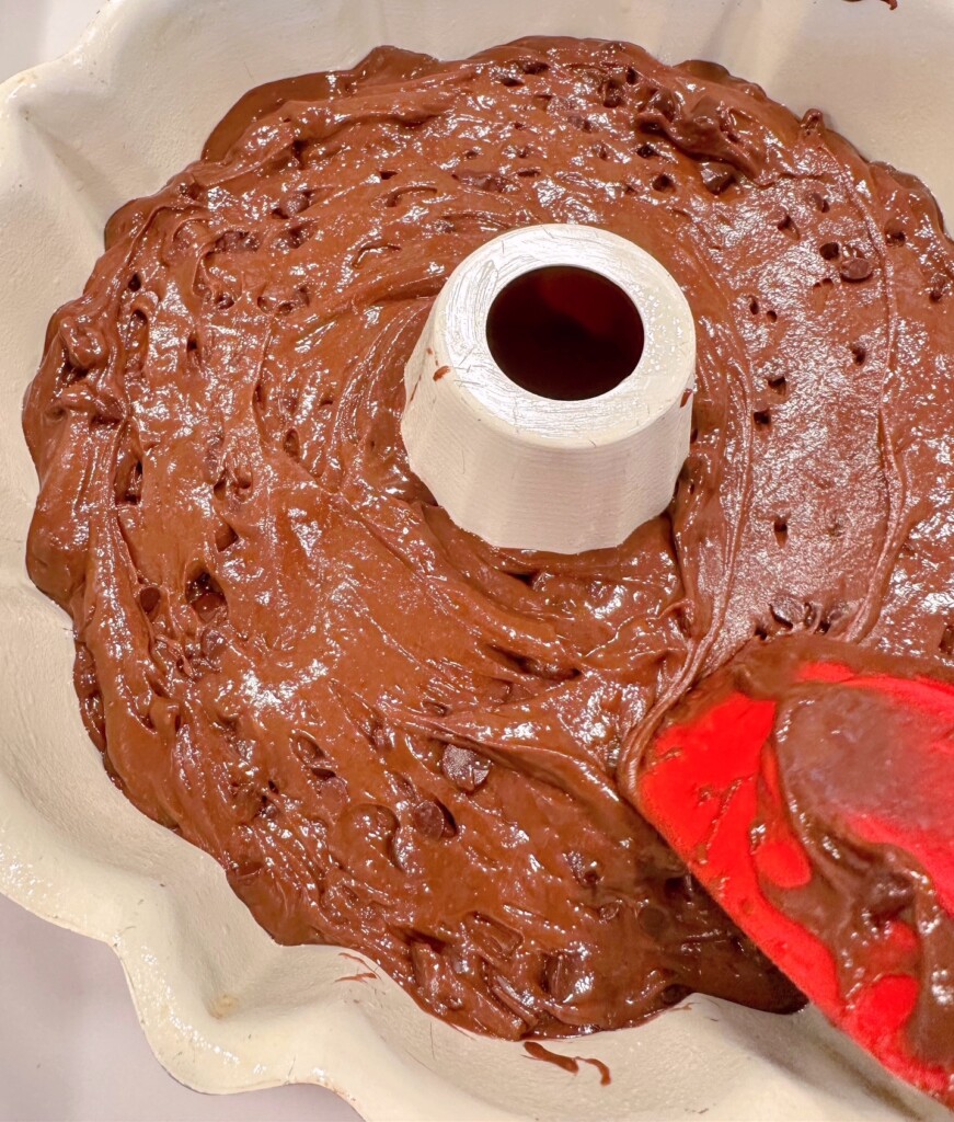 Spreading too much chocolate cake batter in bundt pan.