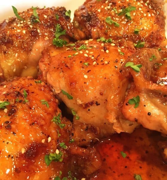 Topped Honey Garlic Thighs with sesame seeds and parsley