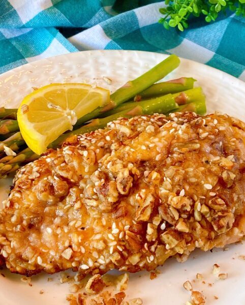 Chicken breast on a plate with asparagus