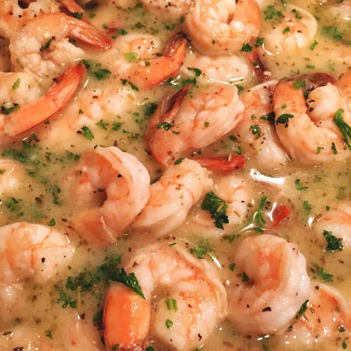 Big juicy tender shrimp in a skillet with a delicious butter wine sauce ready for the lingunie