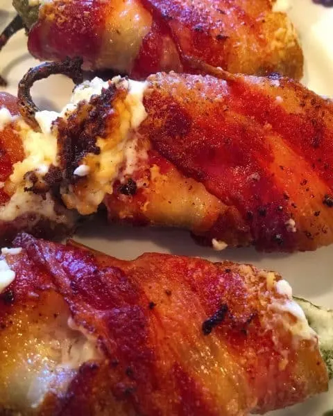 stuffed jalapeno peppers with cream cheese wrapped in crispy bacon