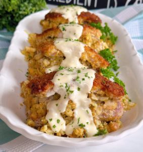 Stuffed Pork Chops on a serving platter with simple gravy.