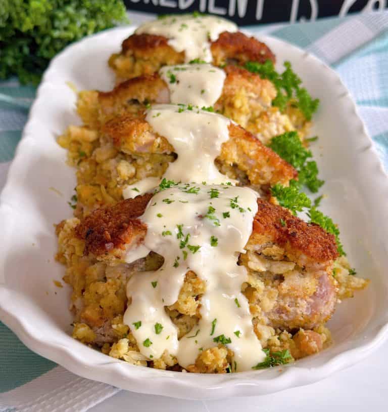 Stuffed Pork Chops on a serving platter with simple gravy.