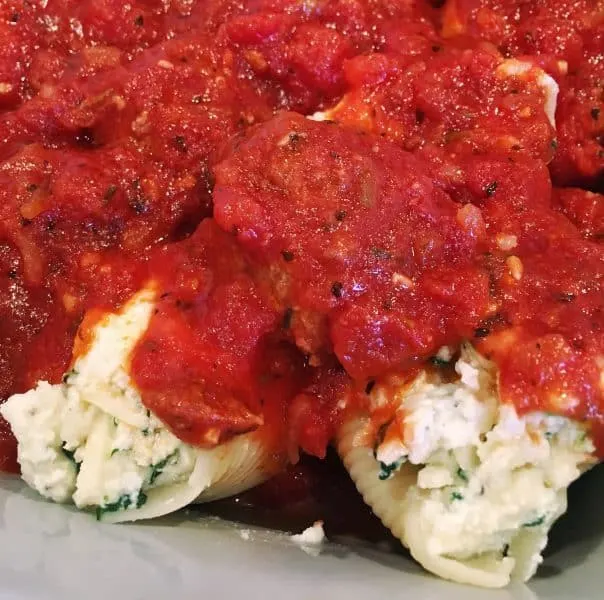 Sauce with meatballs over stuffed shells