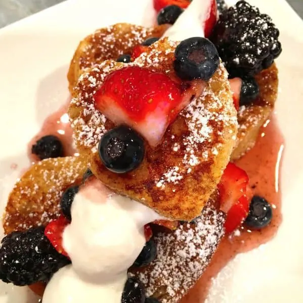 French Toast and berries topped with Amaretto cream and syrup