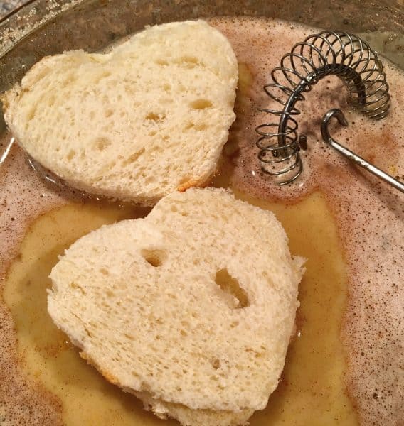 Dipping bread in the French Toast Batter