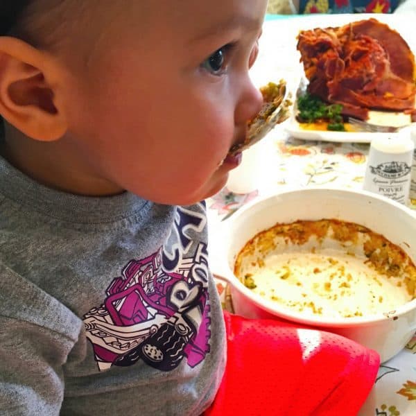 Baby eating the last drop of Broccoli Puff