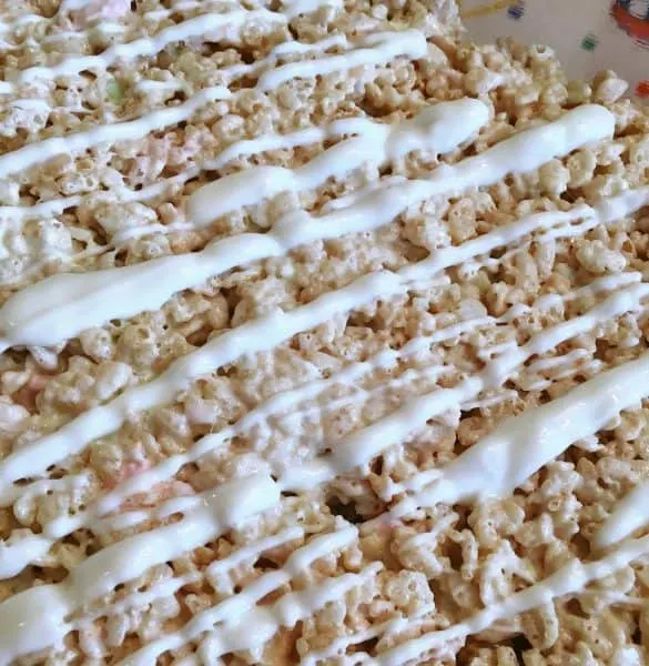 Rice Krispie treats drizzled with white chocolate