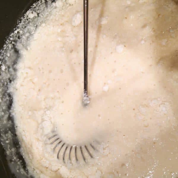 Adding grated Parmesan