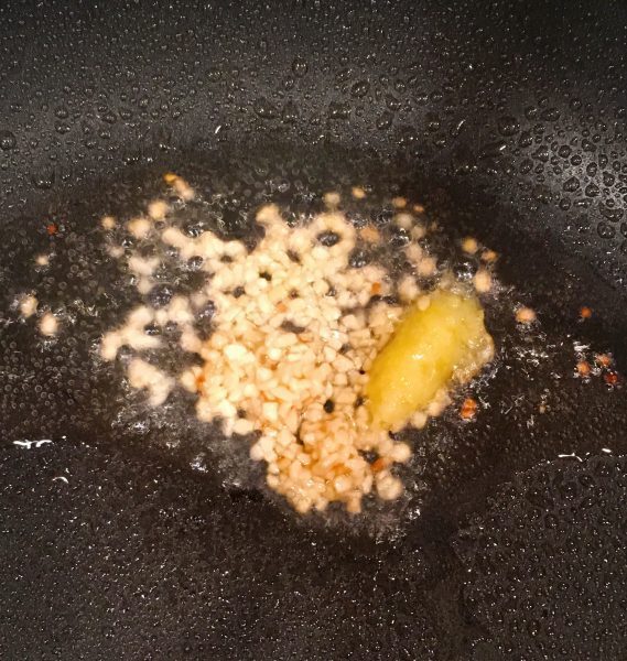 Add garlic and ginger to fry pan.