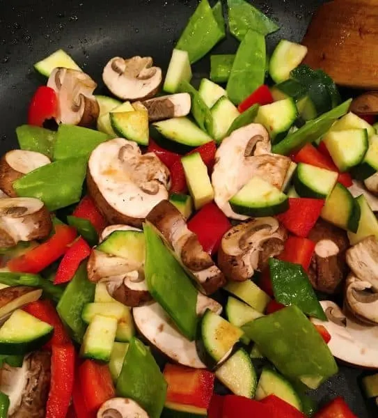 Mixed vegetables stir fry in a wok