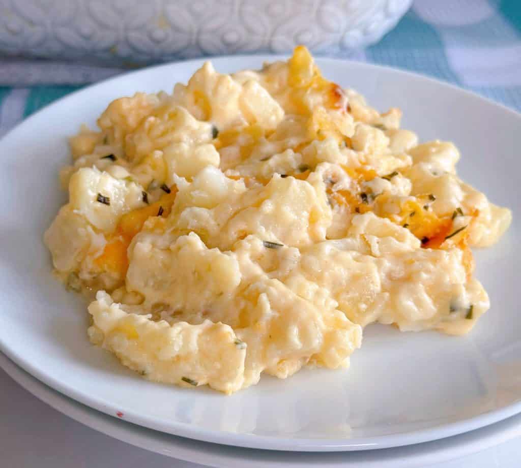Easy Cheesy Funeral potato served on a small white plate.