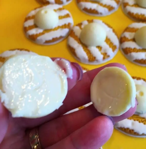 Lindor Truffle cut in half ready to place on top of Keebler Stripe cookie