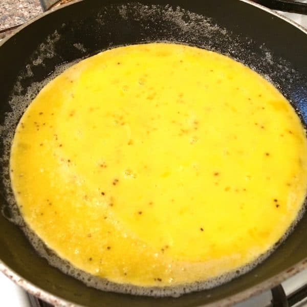 Eggs in a skillet for an Omelet