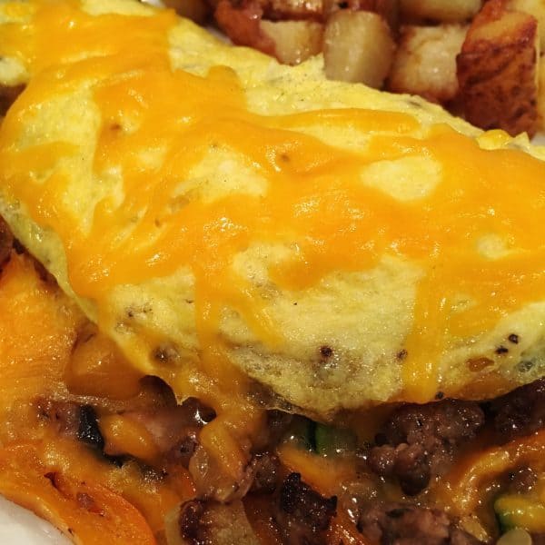 topping omelet with more cheese 