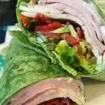 California Club Turkey Wrap cut in half.
