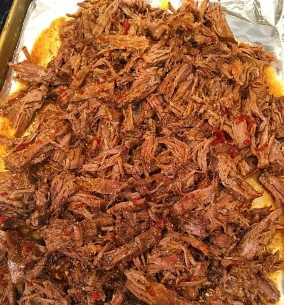 Beef Barbacoa on a cookies sheet toasted in the oven