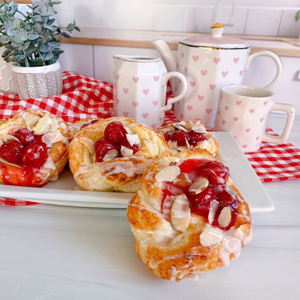 Puff Pastry on a serving tray with a tea pot in the background.