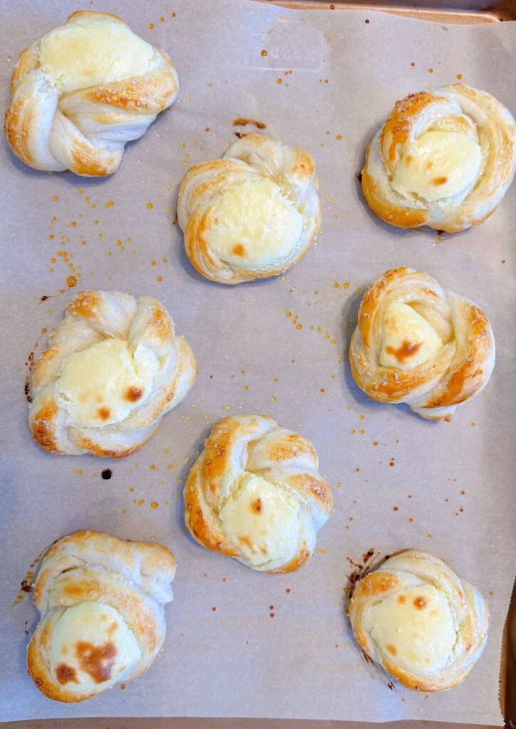Puff pastry slightly baked with cream cheese puffed in the center.