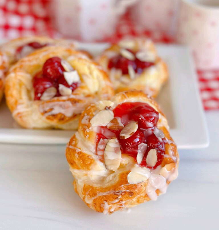 Cherry Cream Cheese Knots piled on a plate.