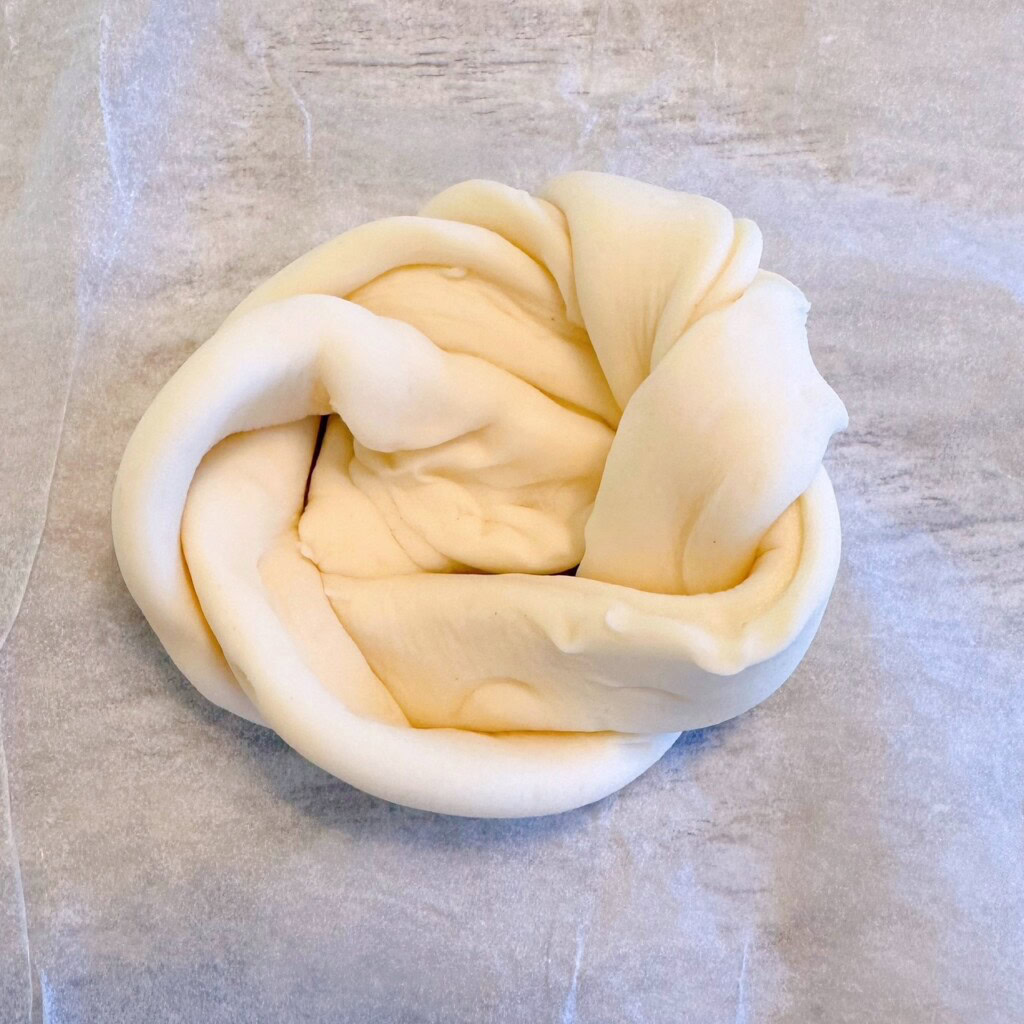 Twisted Puff Pastry tied into a loose knot.