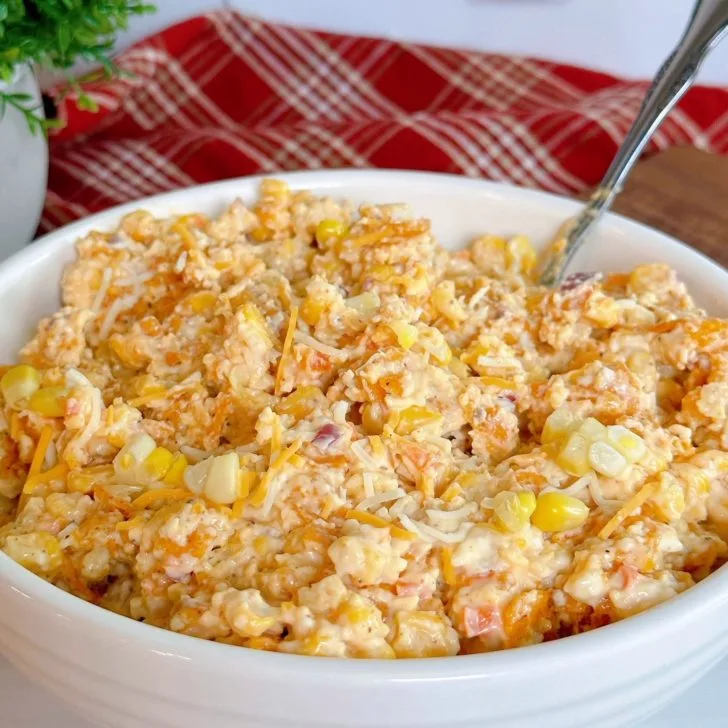 Frito Corn Salad topped with fresh corn ready to serve.
