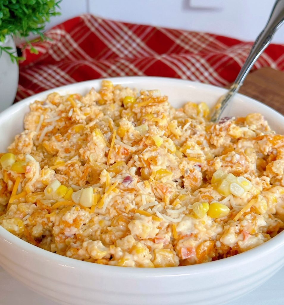 Frito Corn Salad topped with fresh corn ready to serve.