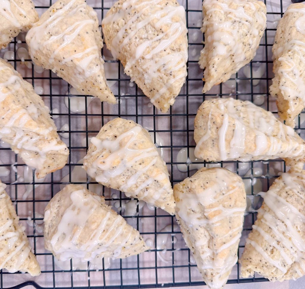 Lemon glaze on top of lemon poppy seed scones.