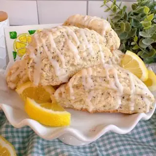 Lemon Poppy Seed Scones piled high on a mini cake plate.