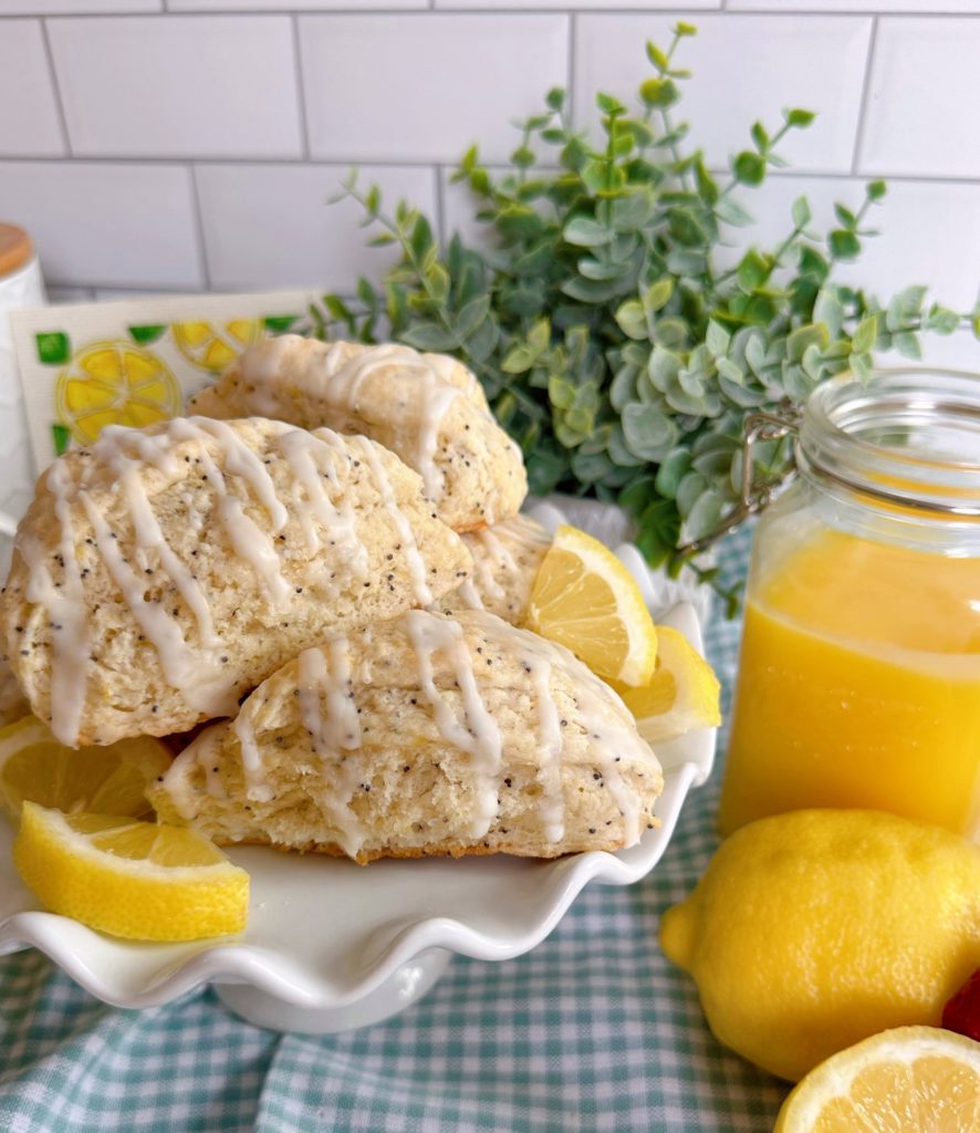 Lemon Poppy Seed Scones piled high on a plate.