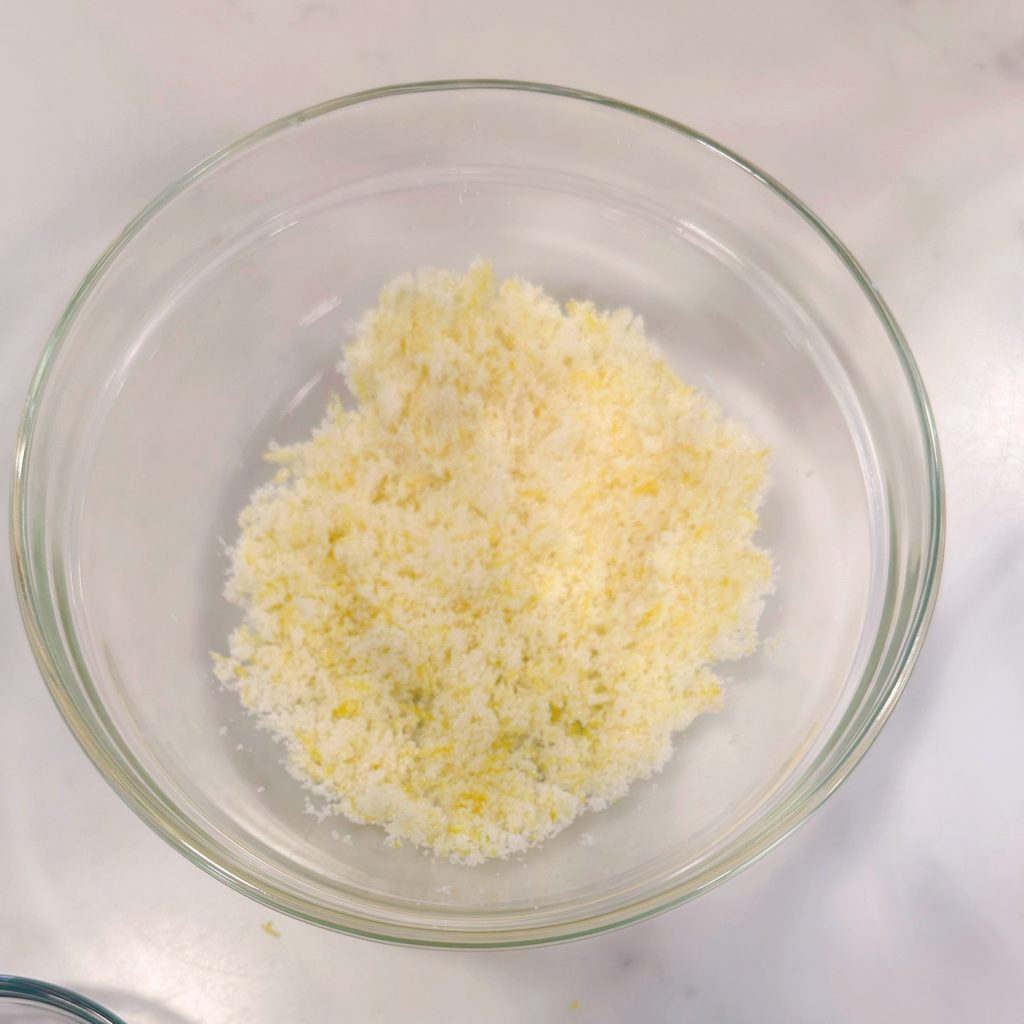 Sugar and Lemon Zest combine in a small bowl.