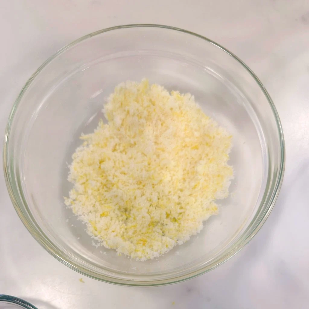 Sugar and Lemon Zest combine in a small bowl.