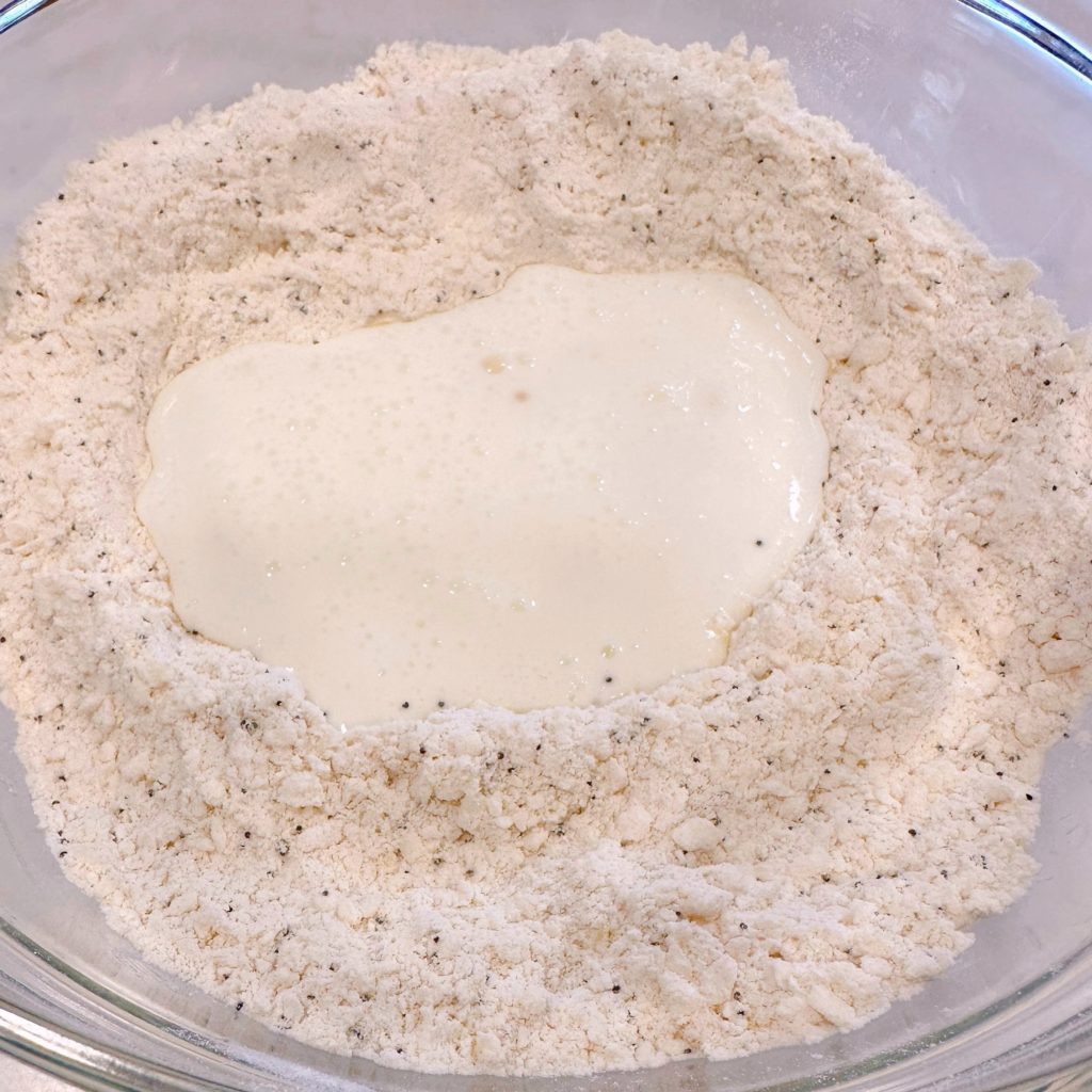 Buttermilk in a well in the center of the dry ingredients for scones.