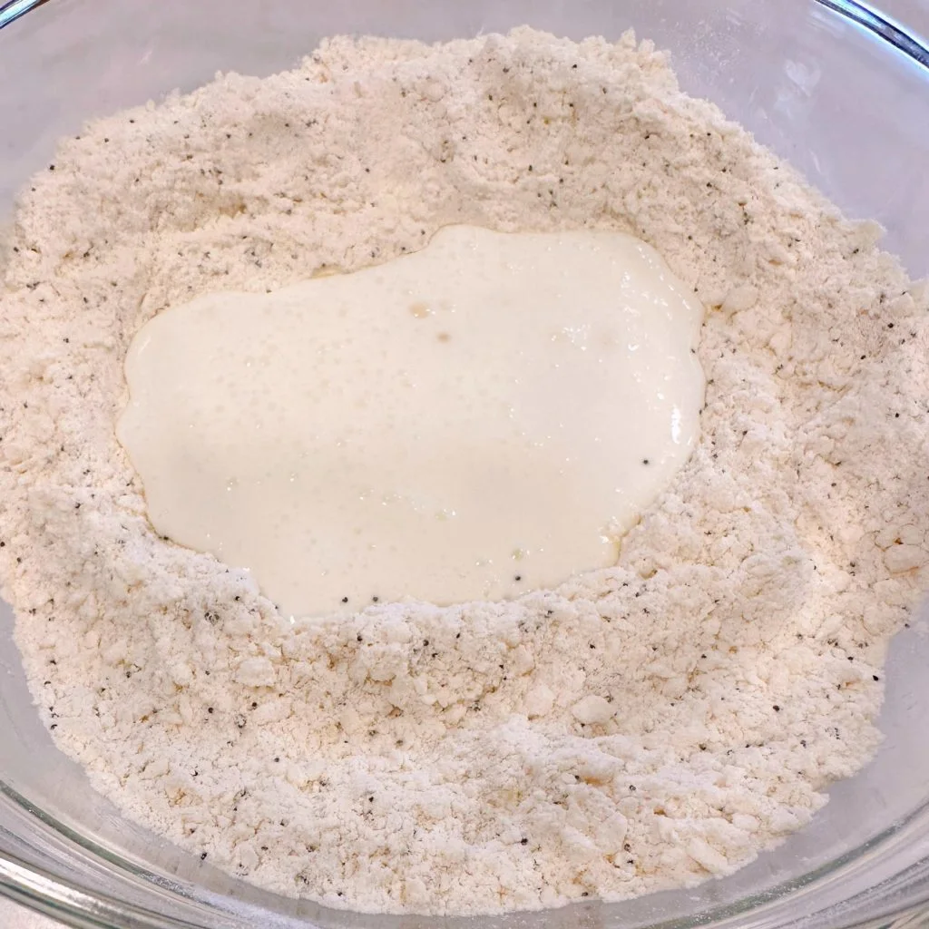 Buttermilk in a well in the center of the dry ingredients for scones.