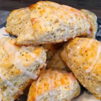 a plate filled with lemon flavored scones