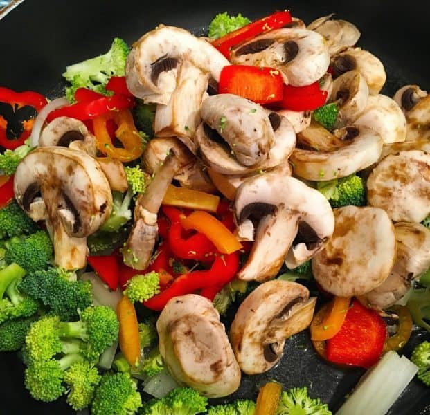 sauteed veggies in skillet for quiche